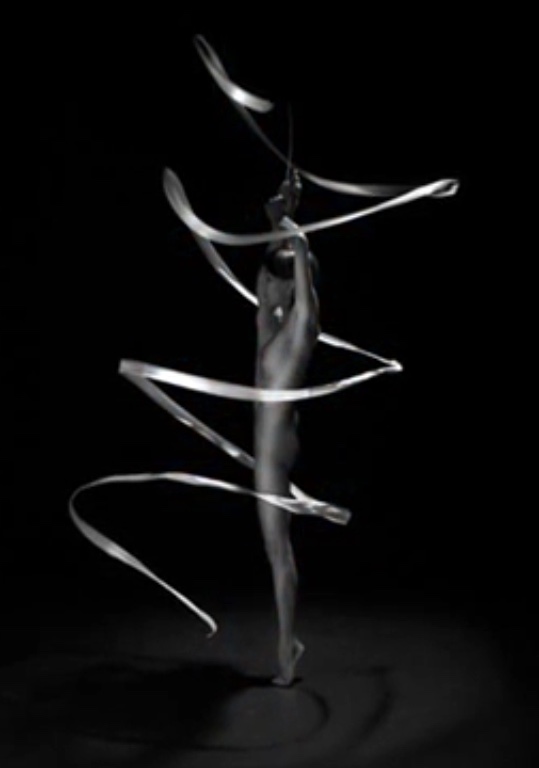 Image of a ballet dancer entwined with a spiraling string of light